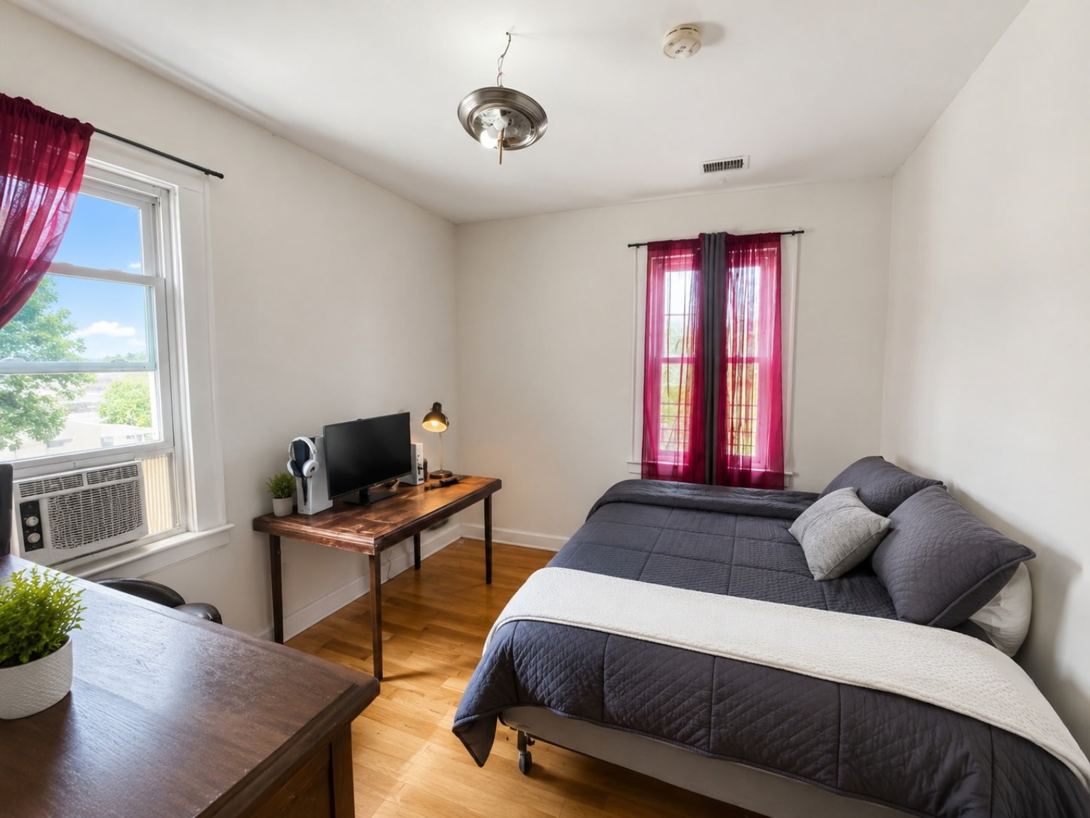 Bedroom arranged with a workspace
